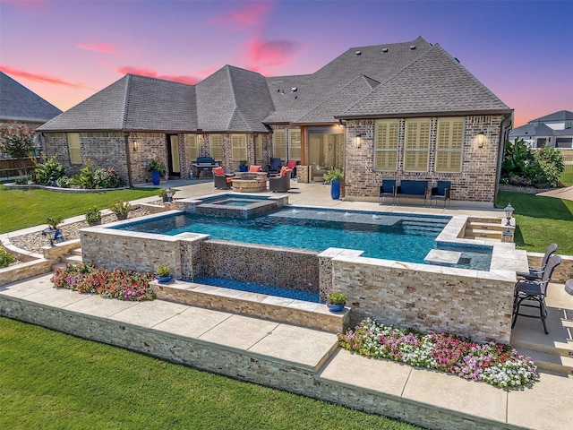 view of swimming pool featuring an outdoor living space, a yard, a grill, and a patio area