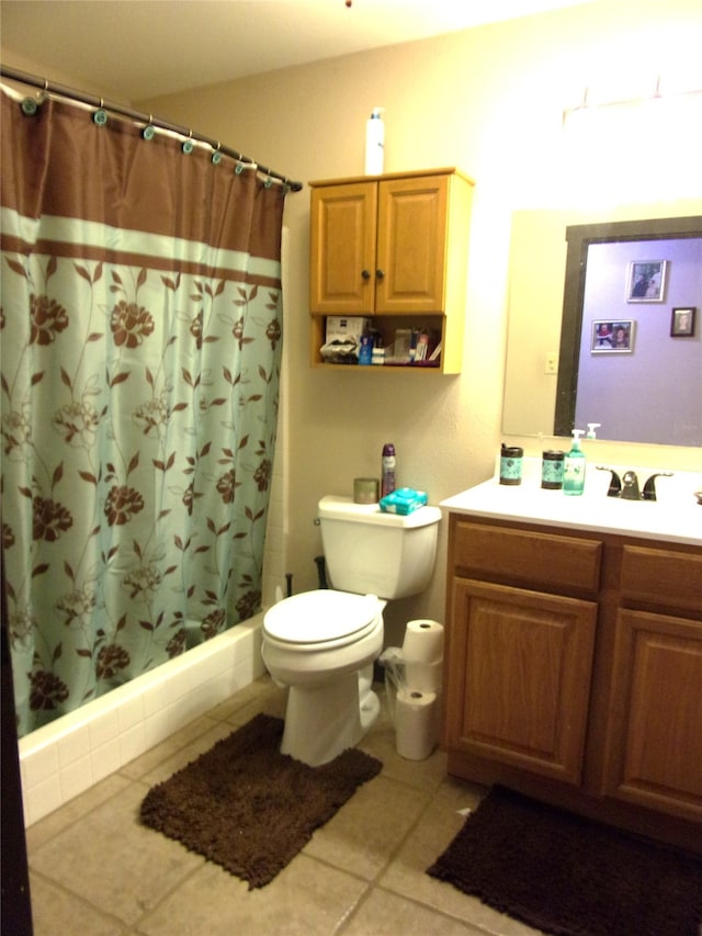 full bathroom featuring shower / bath combo, tile patterned floors, vanity, and toilet