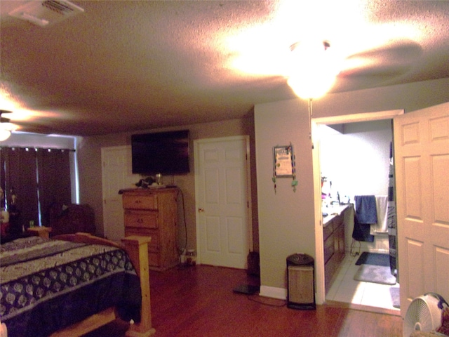 bedroom with hardwood / wood-style floors and ceiling fan