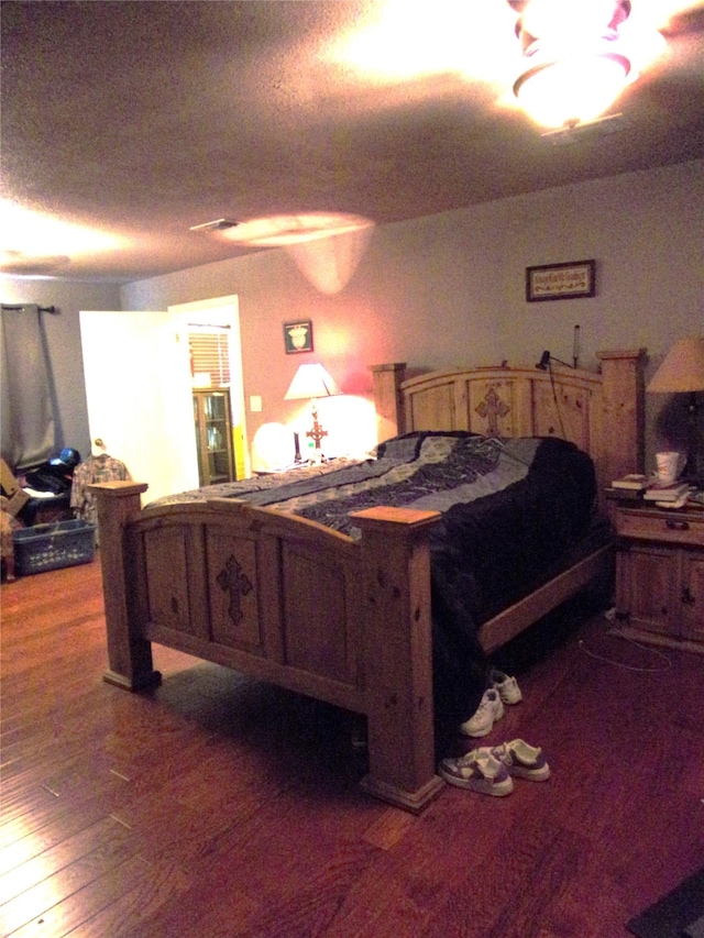 bedroom featuring hardwood / wood-style floors