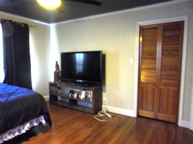 bedroom with ceiling fan and dark wood-type flooring