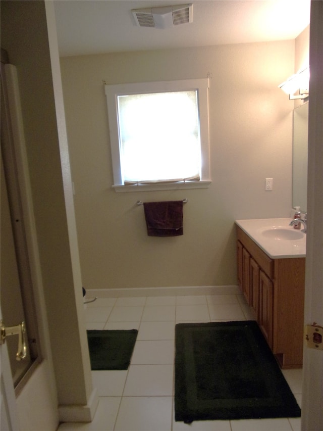 bathroom featuring vanity and tile patterned flooring