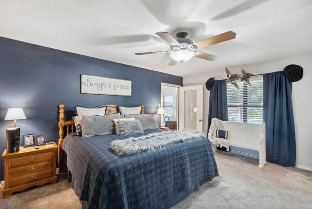 carpeted bedroom with ceiling fan