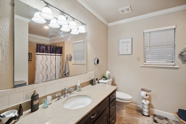 bathroom featuring toilet, tile patterned floors, vanity, ornamental molding, and tasteful backsplash