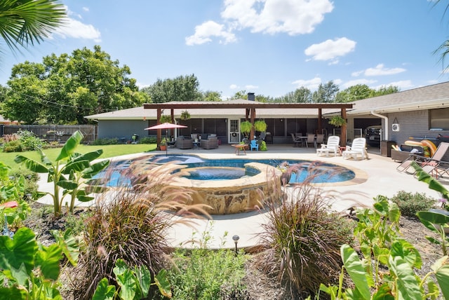 view of pool featuring an in ground hot tub, a patio area, and an outdoor living space