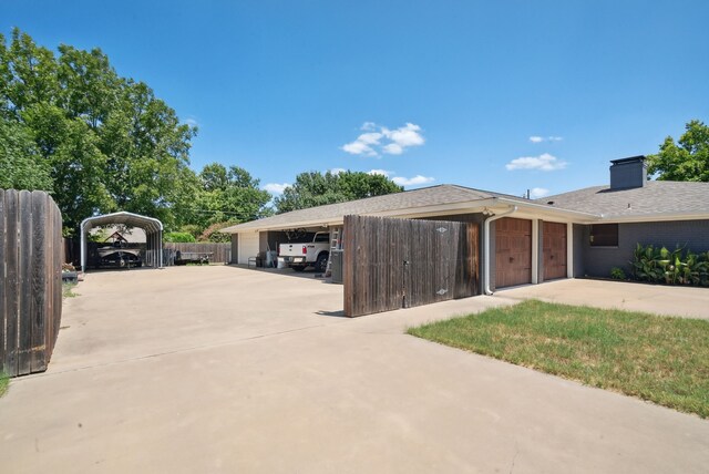 view of side of home featuring a garage