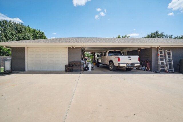 garage featuring a carport