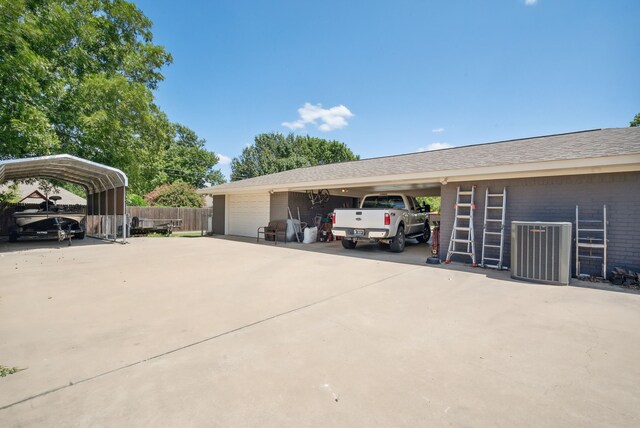 exterior space featuring a garage and a carport