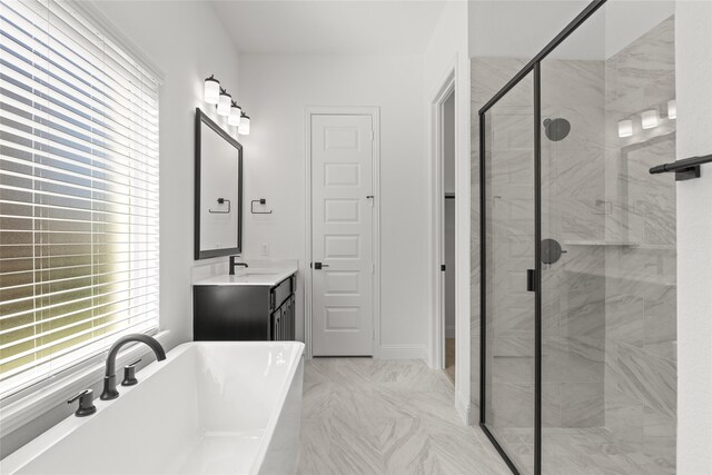 bathroom featuring vanity and a washtub