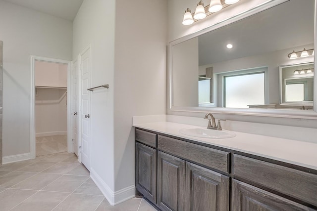 bathroom with tile patterned flooring and vanity