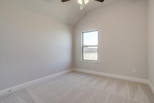 carpeted empty room with lofted ceiling and ceiling fan