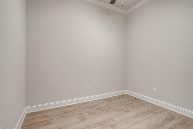 empty room with ceiling fan, ornamental molding, and light hardwood / wood-style flooring