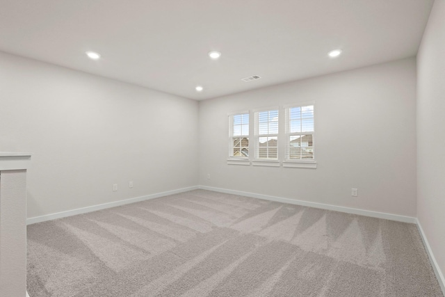 spare room featuring carpet floors