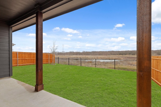 view of yard with a rural view