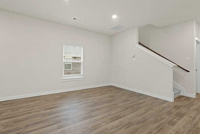 spare room featuring light hardwood / wood-style floors