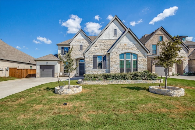 view of front of property featuring a front yard and a garage