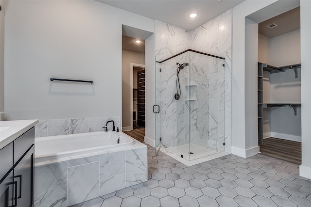 bathroom with vanity and plus walk in shower