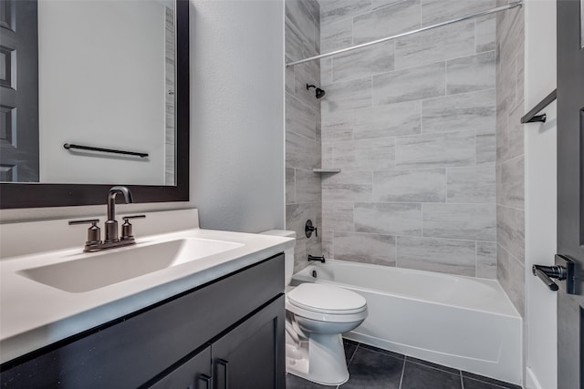 full bathroom with vanity, tiled shower / bath combo, toilet, and tile patterned floors