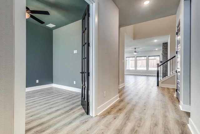 corridor featuring light hardwood / wood-style flooring