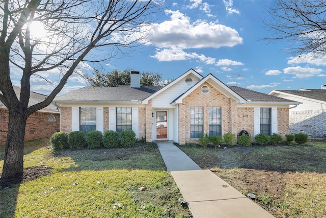 ranch-style home with a front lawn