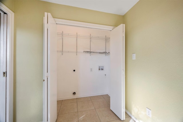 laundry area featuring electric dryer hookup, light tile patterned floors, and hookup for a washing machine