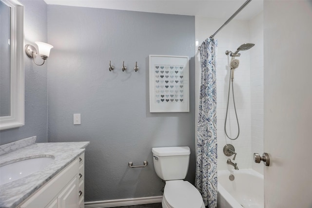 full bathroom featuring shower / bath combo, vanity, and toilet