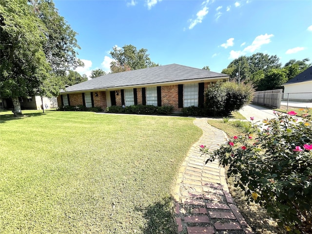 single story home with a front yard