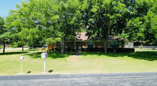 single story home featuring a front yard