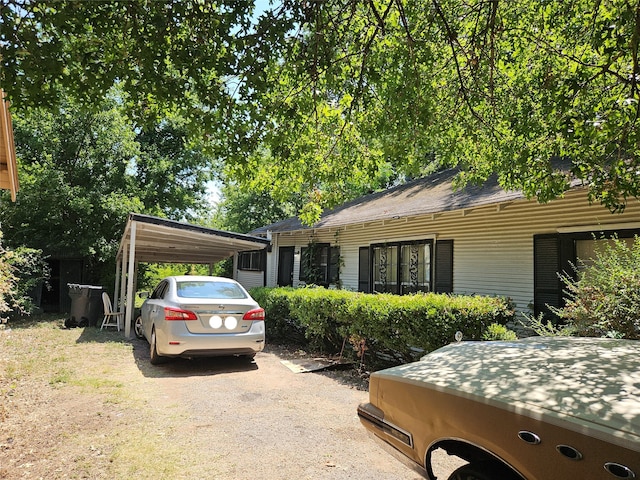 single story home featuring a carport