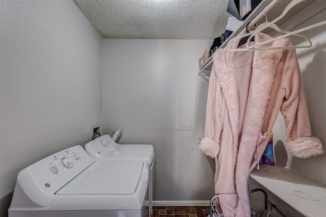 washroom featuring separate washer and dryer and a textured ceiling