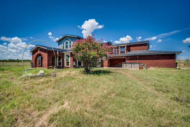 back of house featuring a yard