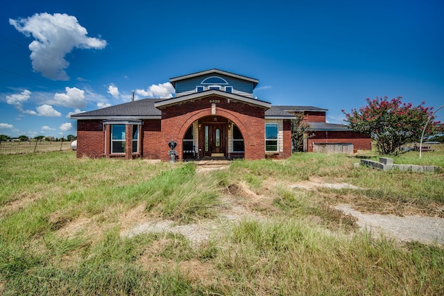 rear view of property with french doors