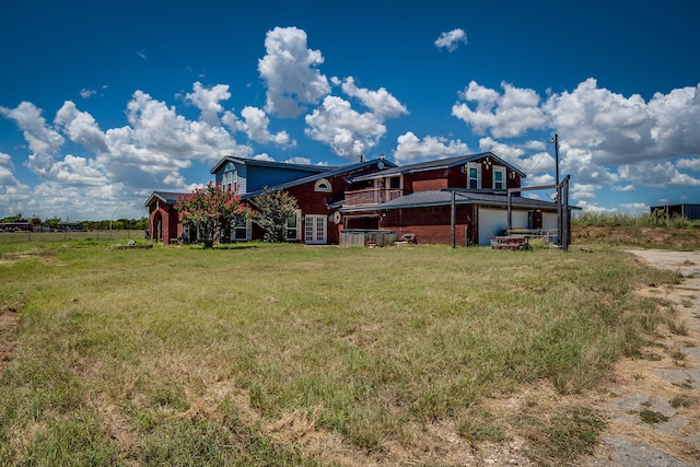 rear view of house with a lawn