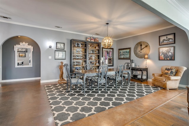 dining space featuring hardwood / wood-style floors, an inviting chandelier, and crown molding