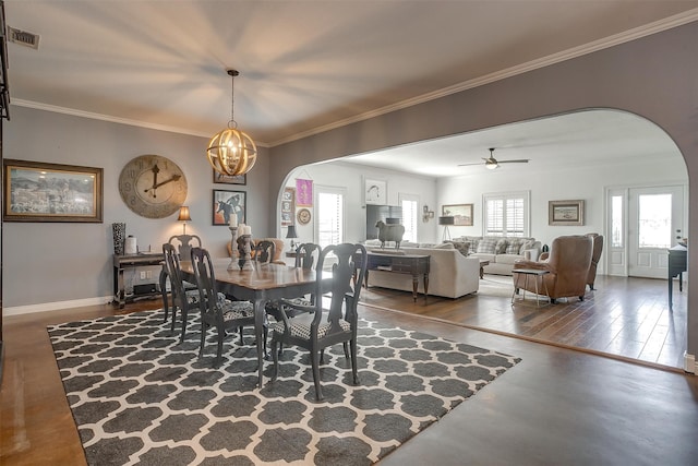 dining room featuring dark hardwood / wood-style floors, ceiling fan, and ornamental molding