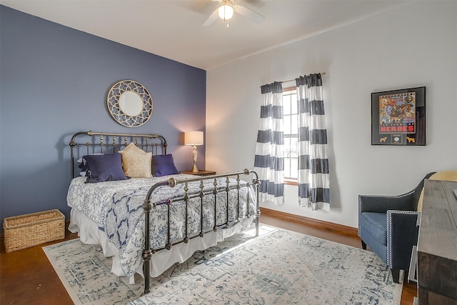 bedroom with hardwood / wood-style flooring and ceiling fan