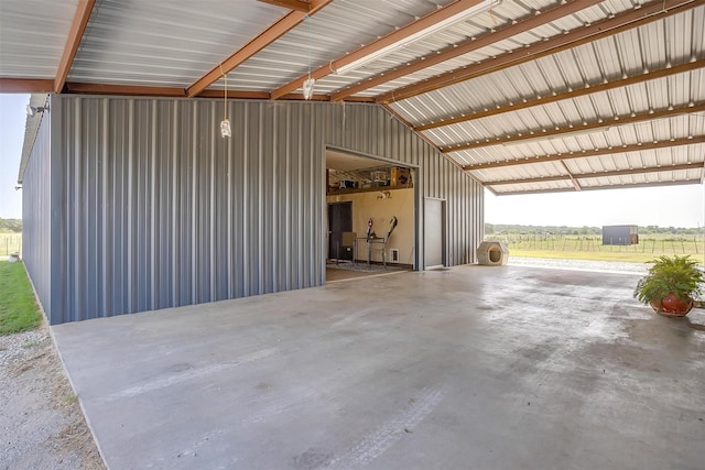 garage featuring a rural view