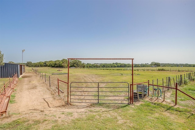 view of gate featuring a rural view