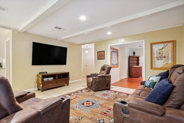 living room with beamed ceiling, light hardwood / wood-style flooring, and ornamental molding