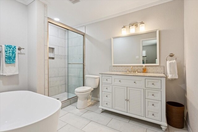 bathroom with toilet, a shower with door, tasteful backsplash, tile patterned floors, and vanity