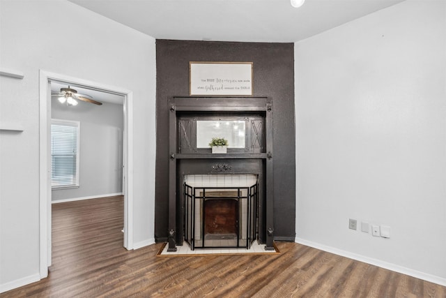 unfurnished living room featuring hardwood / wood-style floors and ceiling fan