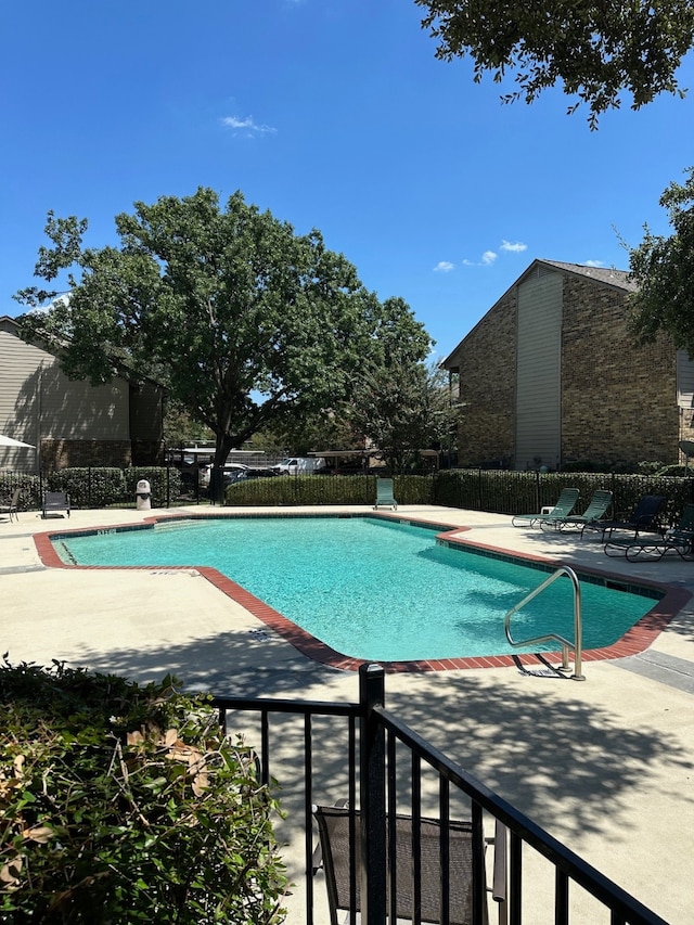 view of pool with a patio area