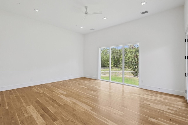 unfurnished room with ceiling fan and light hardwood / wood-style flooring