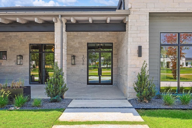 entrance to property featuring french doors