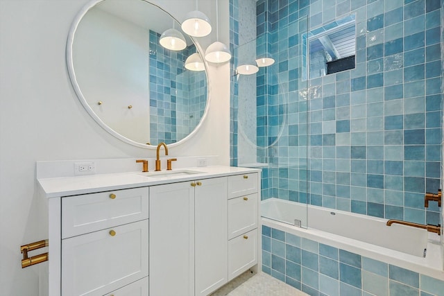 bathroom with tiled shower / bath, tile patterned floors, and vanity