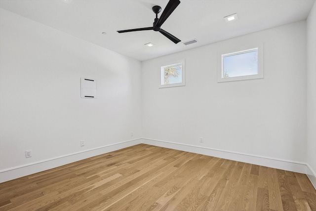 spare room featuring ceiling fan and light hardwood / wood-style floors