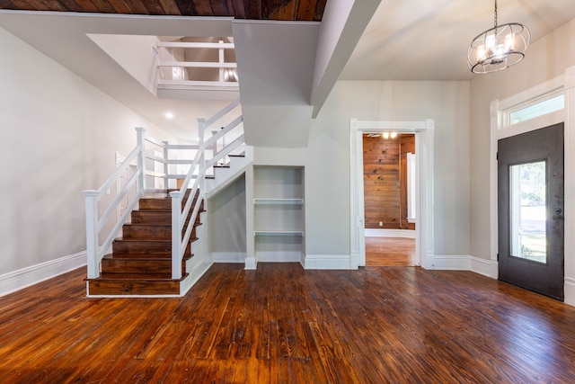 entryway featuring an inviting chandelier and wood-type flooring