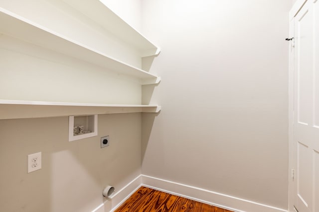 clothes washing area with electric dryer hookup, washer hookup, and dark hardwood / wood-style floors