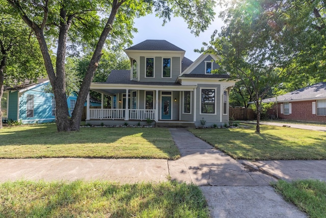 view of front of home with a porch and a front yard