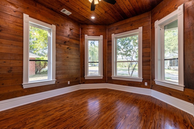 607 N Dallas St, Ennis, TX 75119 - empty room with ceiling fan, dark wood-type flooring, visible vents, and plenty of natural light